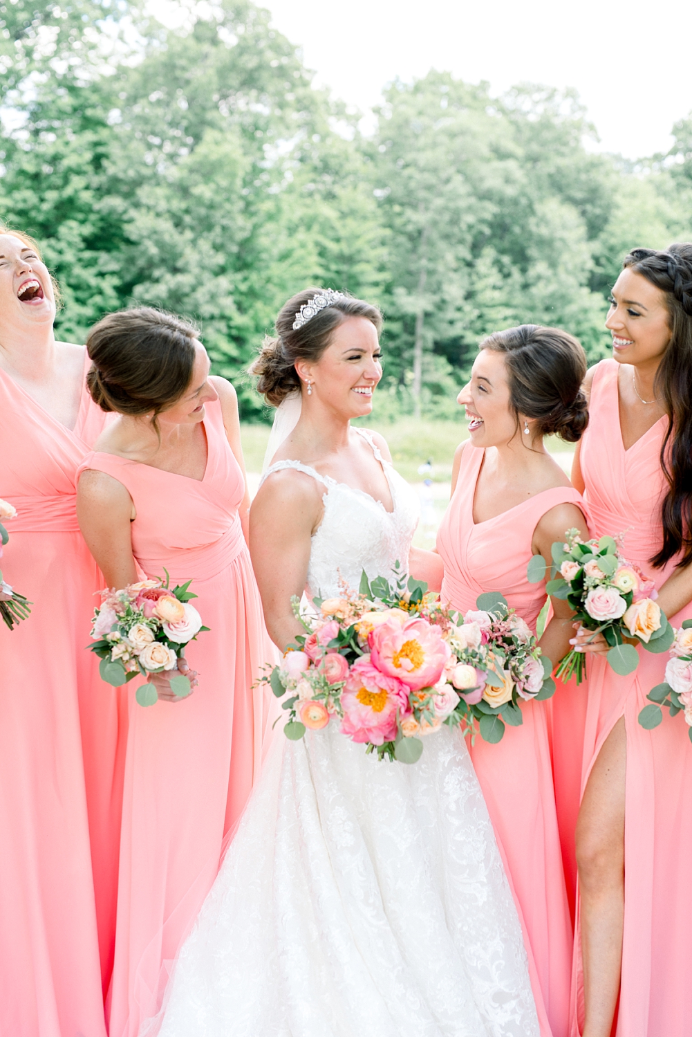 Romantic Garden Themed, Peach and Coral Summertime Wedding by Erika Christine Photography. Coral Bridesmaids dresses
